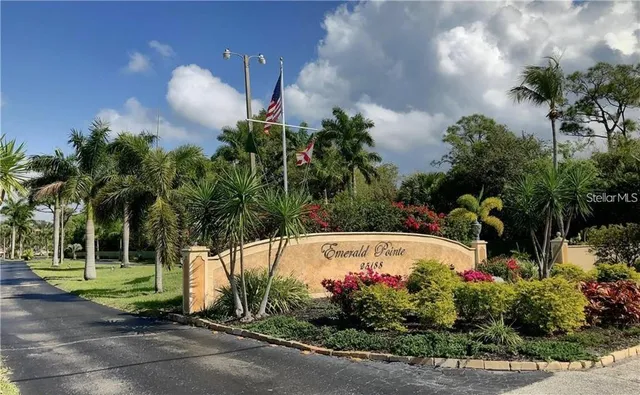 an aerial view of a house with garden space and street view