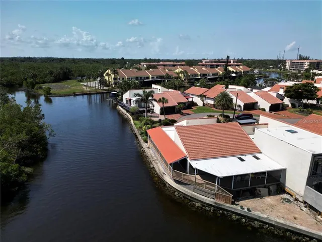 an aerial view of a house with lake view