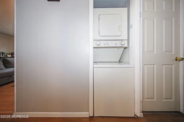 a view of a storage and utility room with washer and dryer