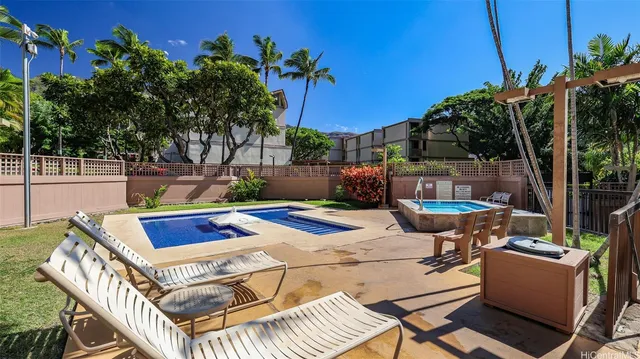 a view of a chairs and table in patio