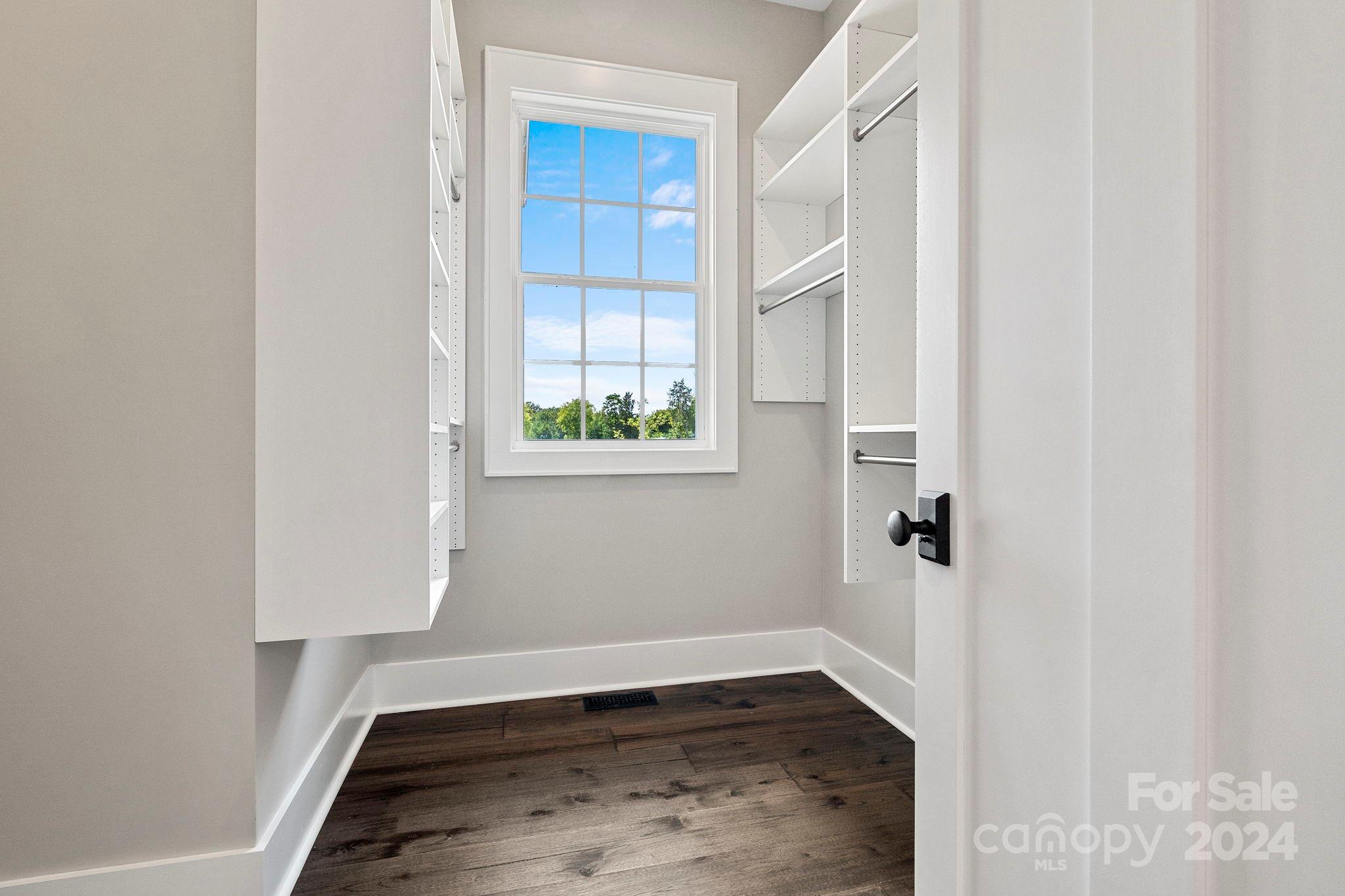 1198 Garvin Road York, SC 29745 - Photo 14 of 45 an empty room with wooden floor and windows