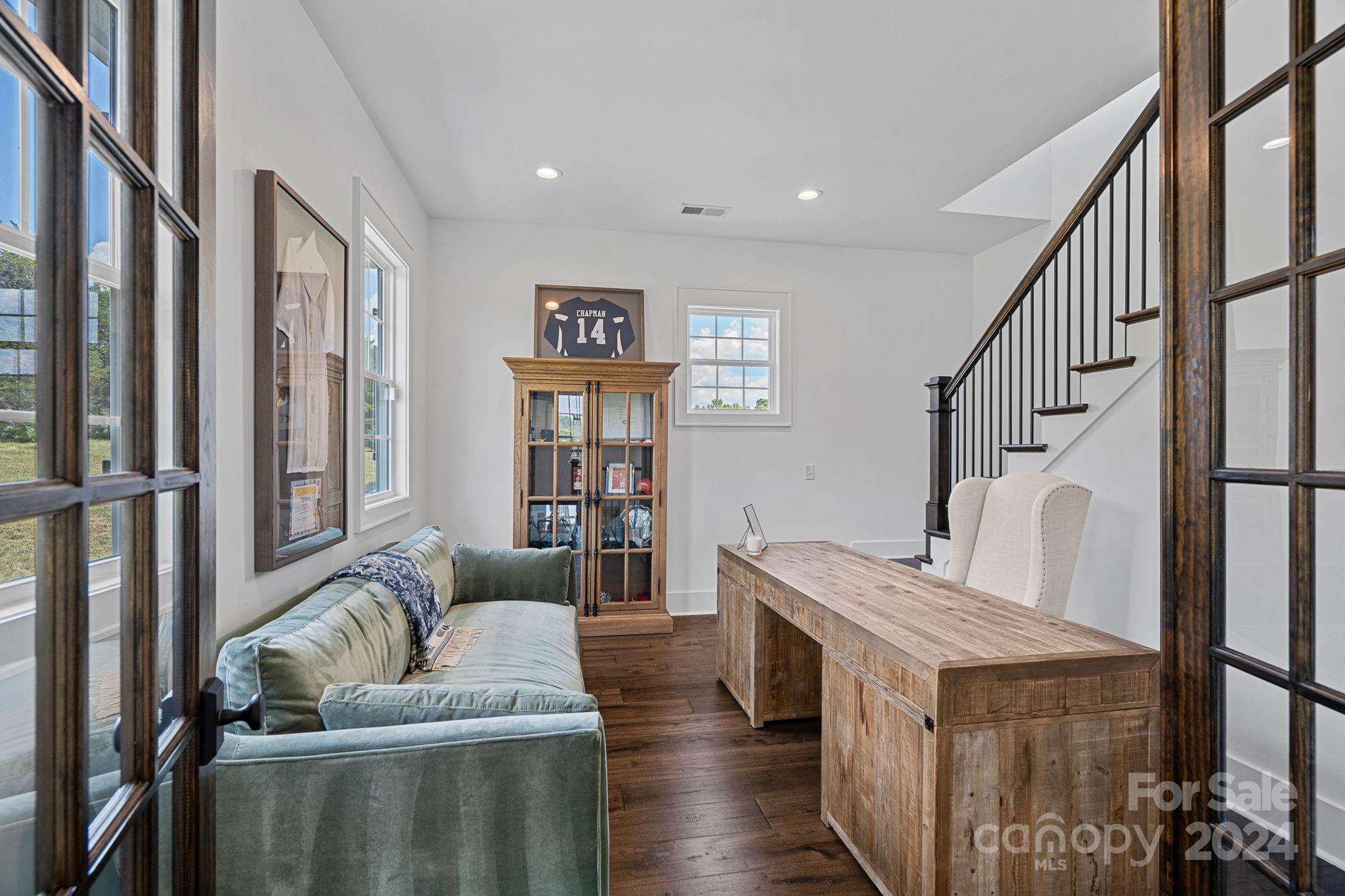 1198 Garvin Road York, SC 29745 - Photo 18 of 45 a living room with furniture and wooden floor