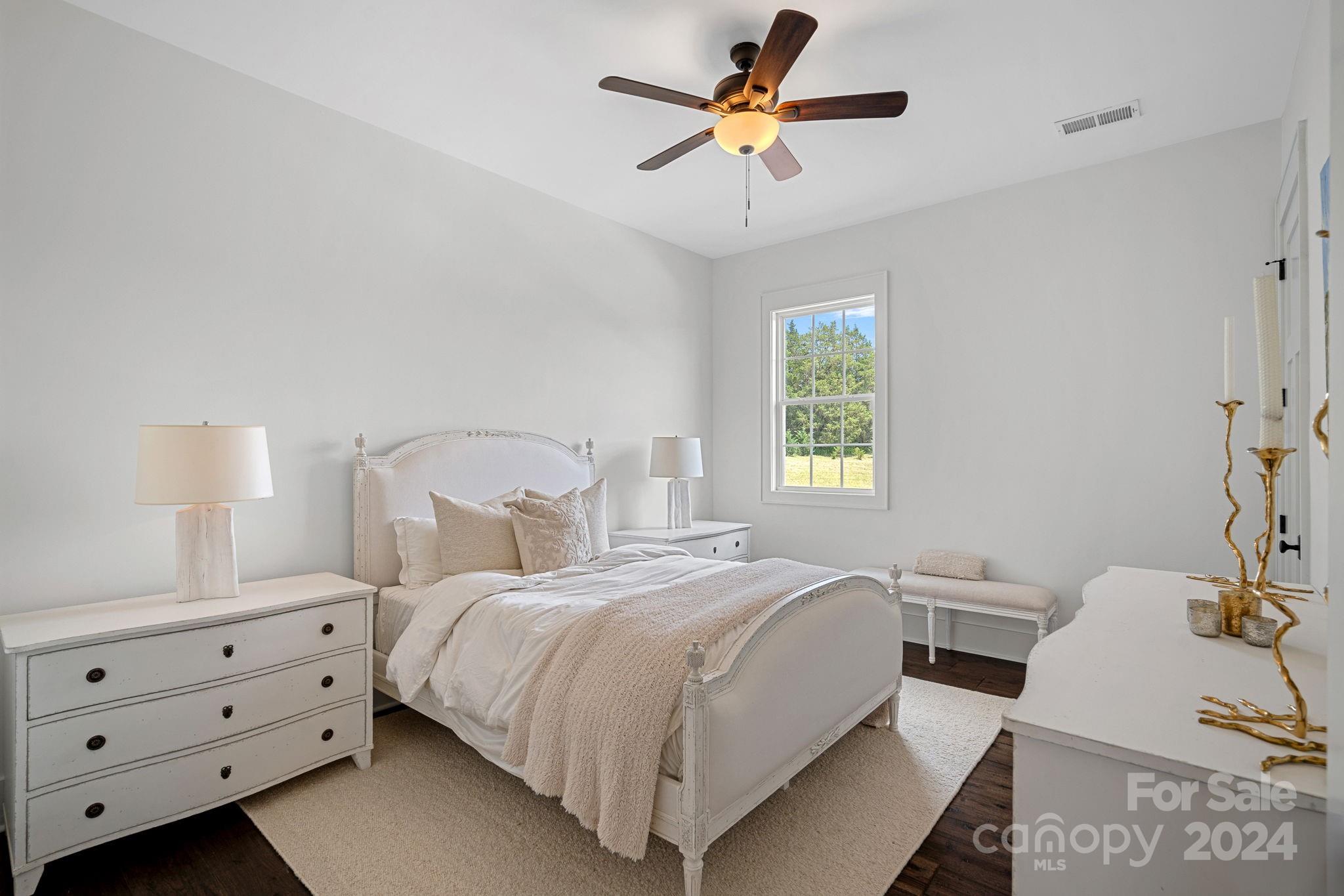 1198 Garvin Road York, SC 29745 - Photo 20 of 45 a bedroom with a bed and a chandelier