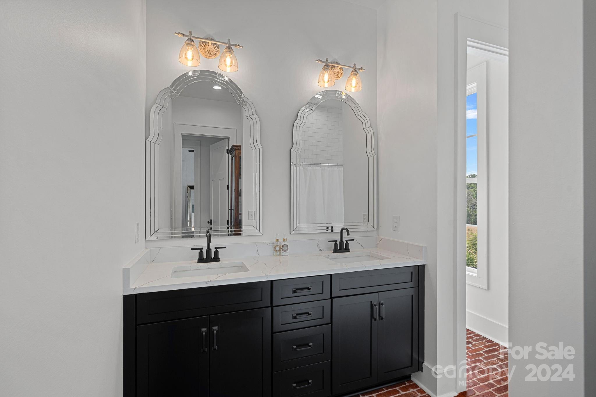 1198 Garvin Road York, SC 29745 - Photo 22 of 45 a bathroom with a double vanity sink and a mirror