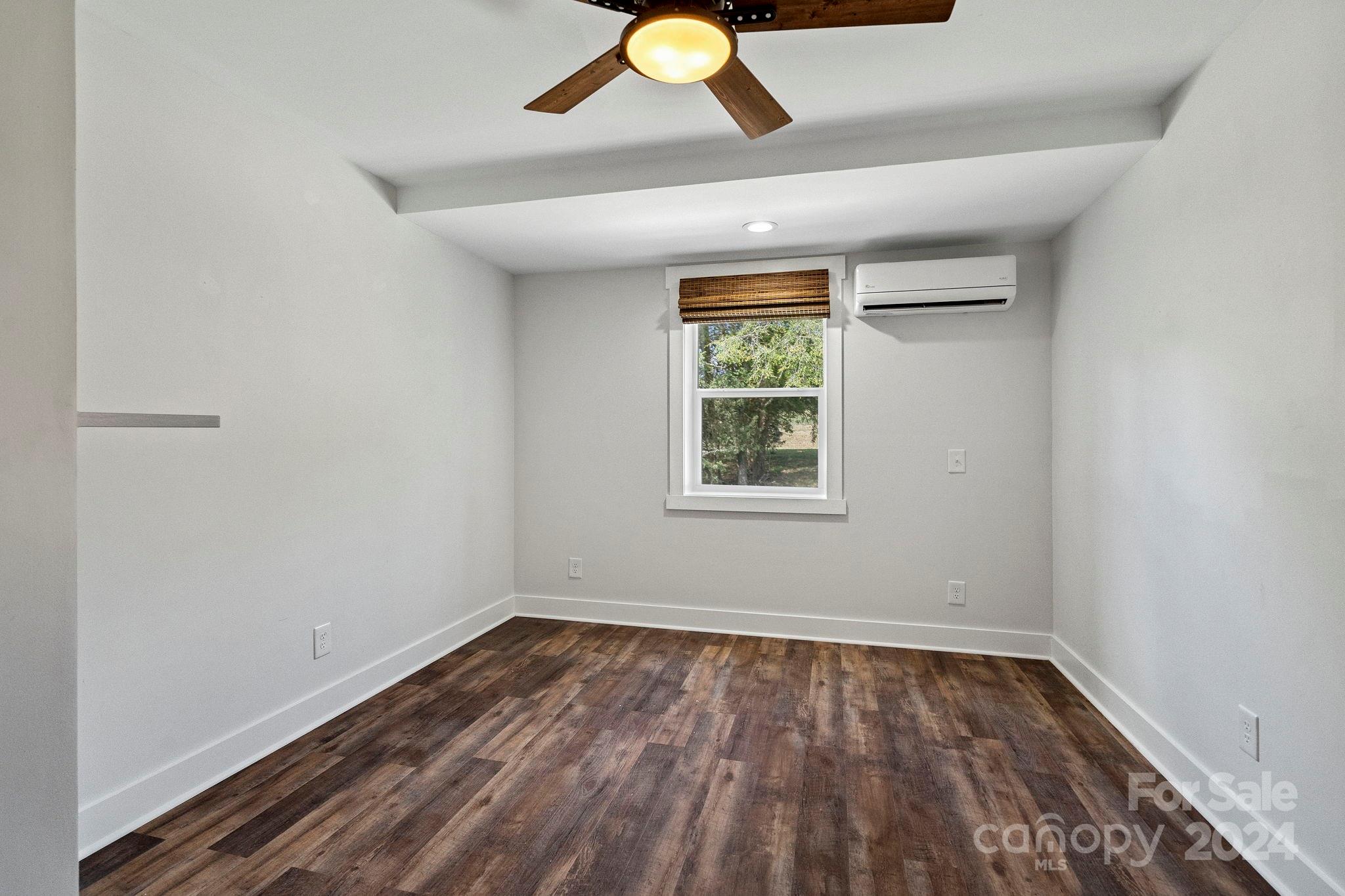 1198 Garvin Road York, SC 29745 - Photo 36 of 45 an empty room with wooden floor and windows