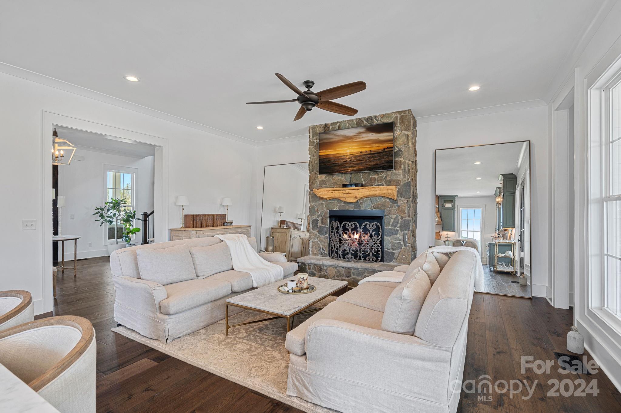 1198 Garvin Road York, SC 29745 - Photo 7 of 45 a living room with furniture a fireplace and a flat screen tv