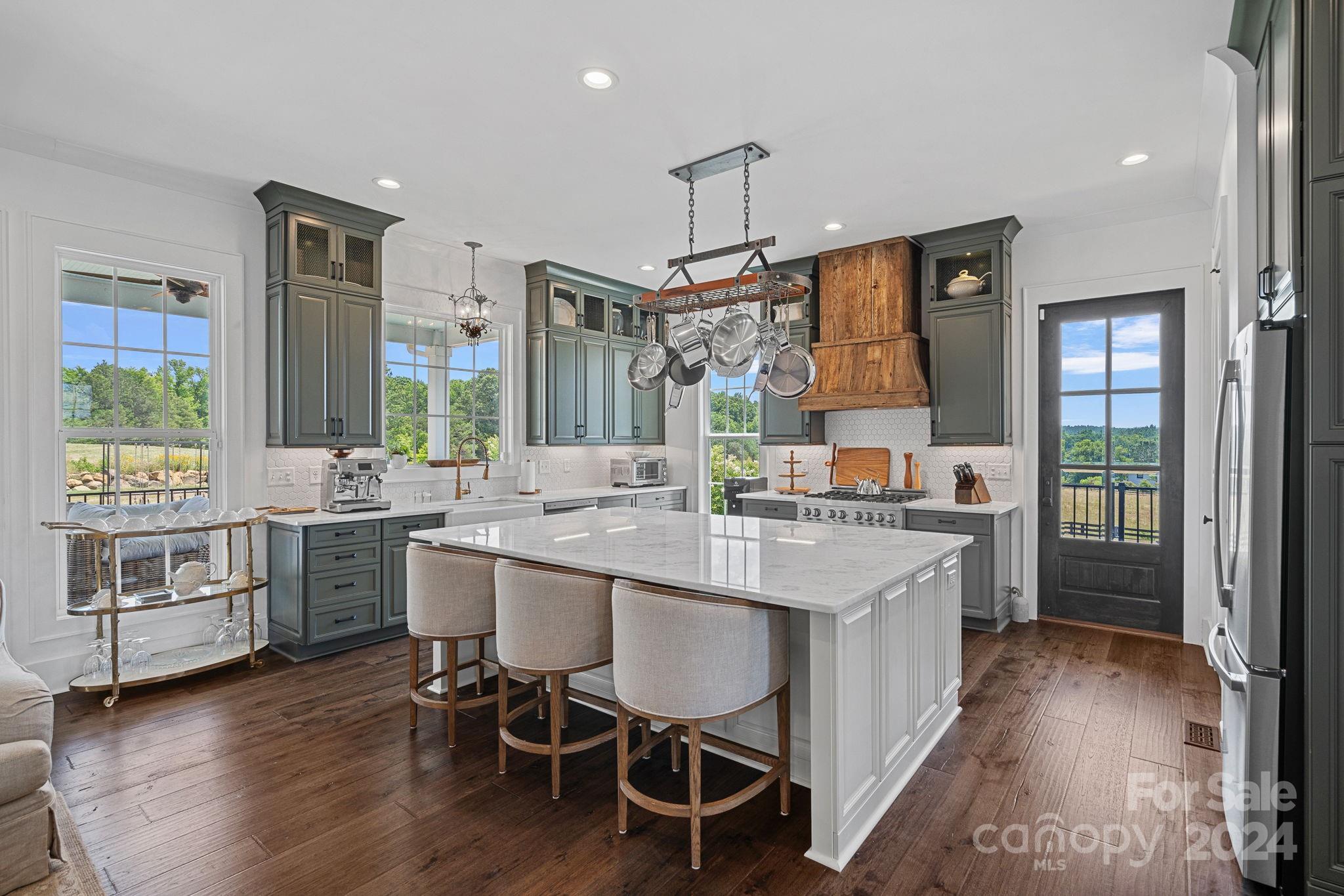 1198 Garvin Road York, SC 29745 - Photo 9 of 45 a kitchen with a sink stove and wooden floor