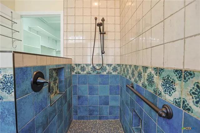 a bathroom with a sink and shower