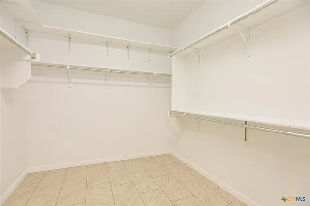 a view of an empty walk in closet