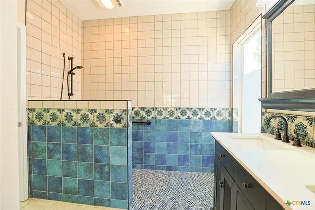 a bathroom with a sink and a shower