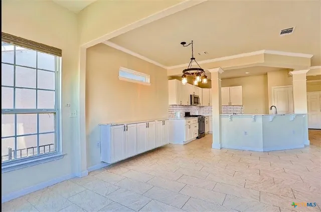 a view of a kitchen with a sink