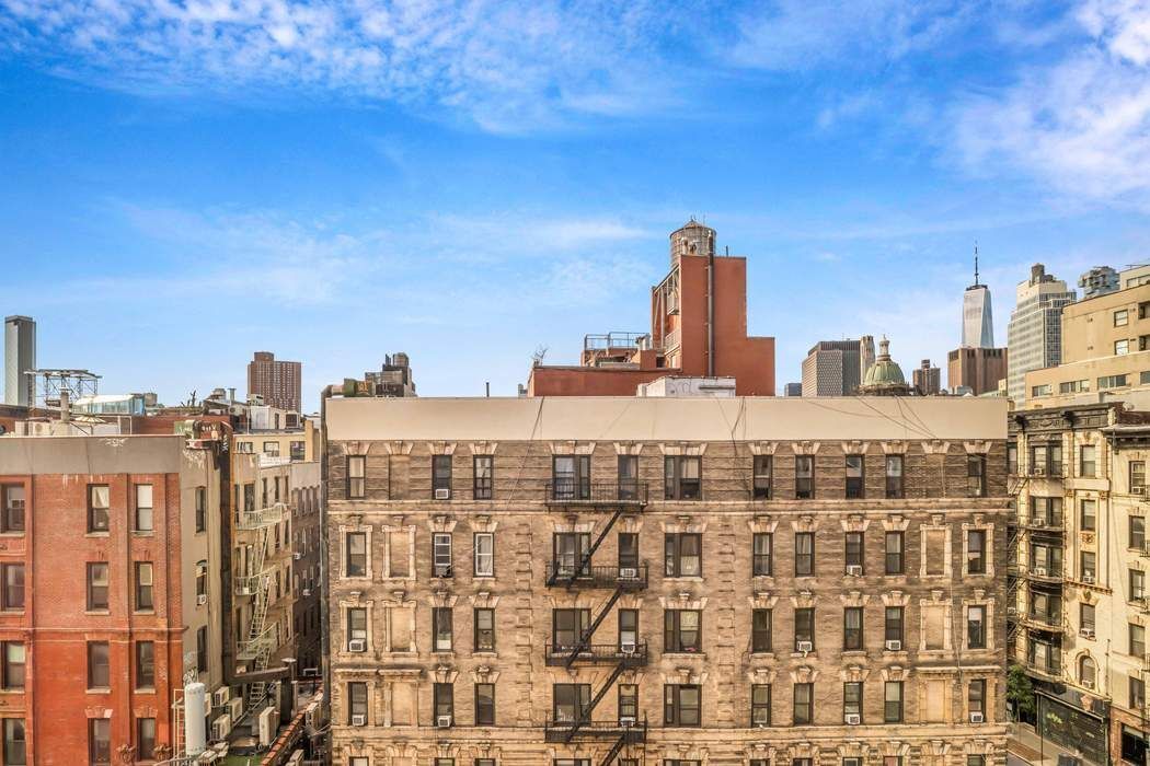 75 Kenmare Street, Unit 6B Manhattan, NY 10012 - Photo 10 of 11 a view of a city with tall buildings