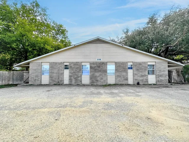 a view of a house with a yard and garage