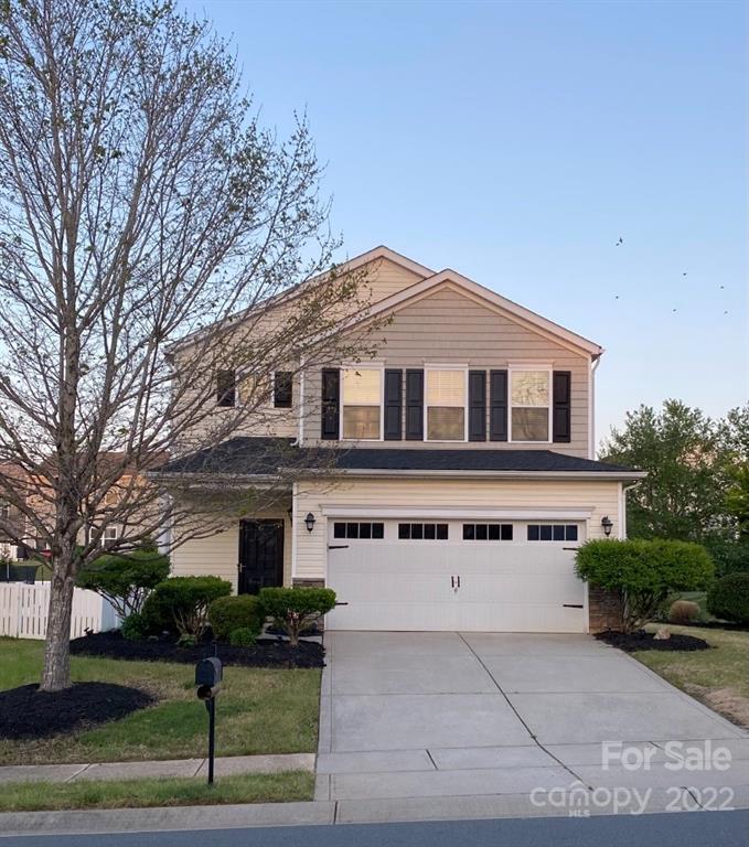 12014 Downy Birch Road, Unit 436 Charlotte, NC 28227 - Photo 1 of 26 a front view of a house with garden