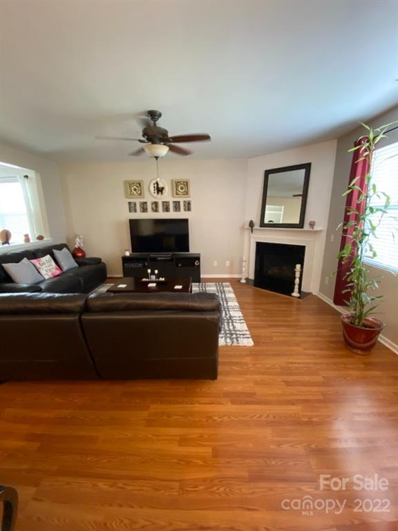 12014 Downy Birch Road, Unit 436 Charlotte, NC 28227 - Photo 15 of 26 a living room with furniture and a fireplace