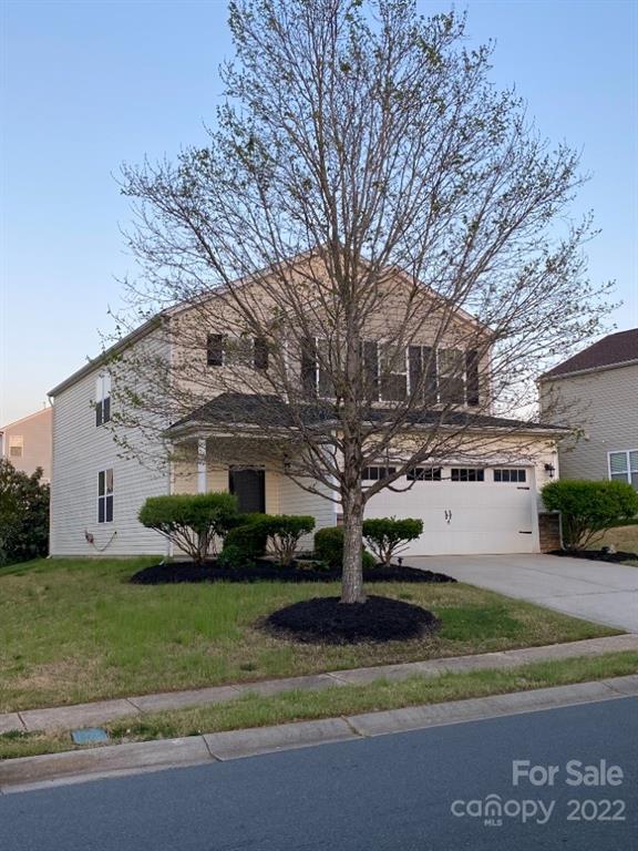 12014 Downy Birch Road, Unit 436 Charlotte, NC 28227 - Photo 2 of 26 a front view of a house with a yard