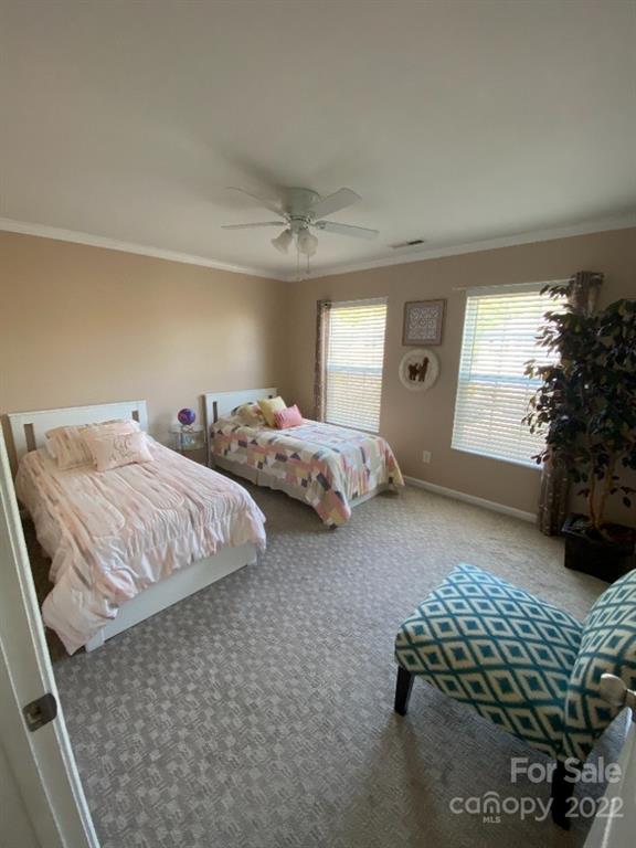 12014 Downy Birch Road, Unit 436 Charlotte, NC 28227 - Photo 22 of 26 a bedroom with bed and window