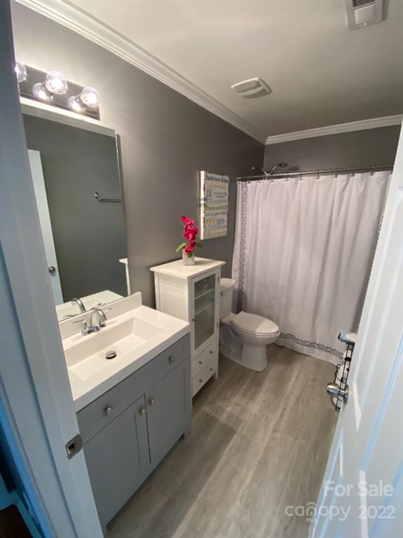 12014 Downy Birch Road, Unit 436 Charlotte, NC 28227 - Photo 26 of 26 a bathroom with a double vanity sink mirror and toilet