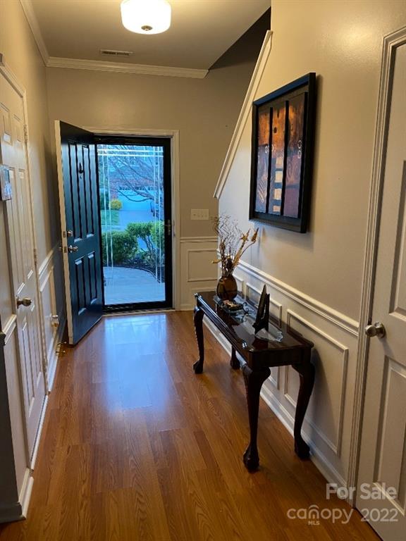 12014 Downy Birch Road, Unit 436 Charlotte, NC 28227 - Photo 5 of 26 a room with wooden floor and windows