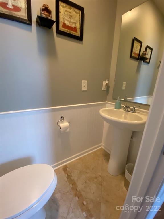 12014 Downy Birch Road, Unit 436 Charlotte, NC 28227 - Photo 9 of 26 a bathroom with a sink and a toilet
