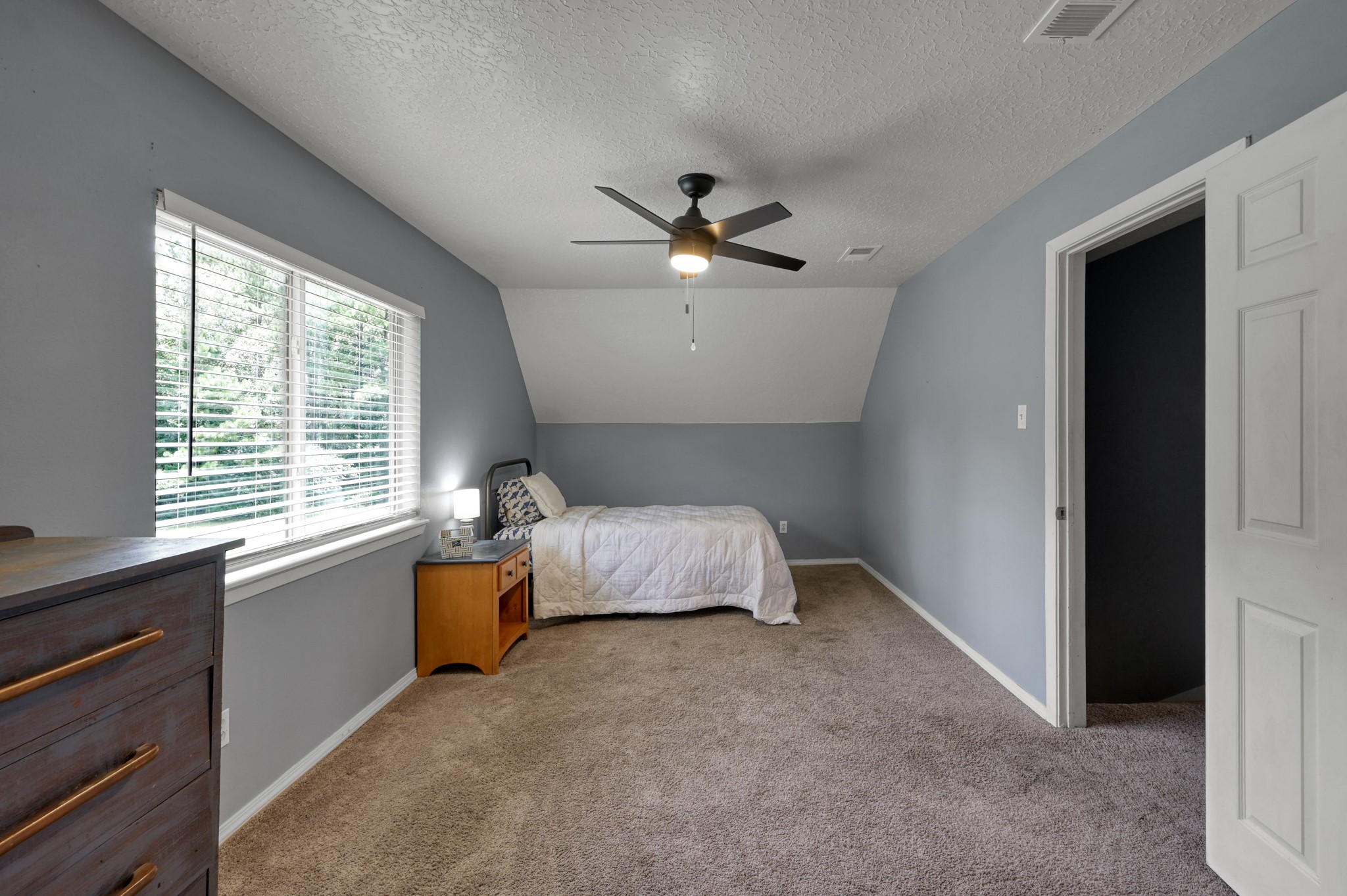 14909 Pine Tree Road Montgomery, TX 77356 - Photo 24 of 49 When upstairs immediately to your right there is a spacious 2nd bedroom, closet door is to the right of bedroom door