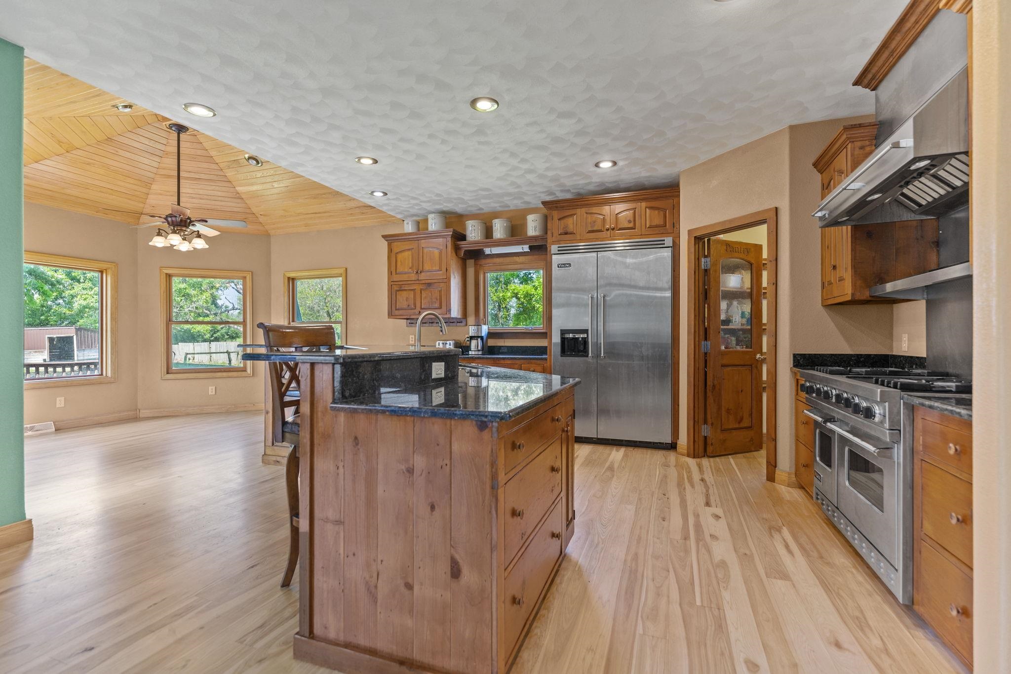 12830 Beloit Road Caledonia, IL 61011 - Photo 14 of 52 a kitchen with stainless steel appliances granite countertop sink stove top oven and cabinets