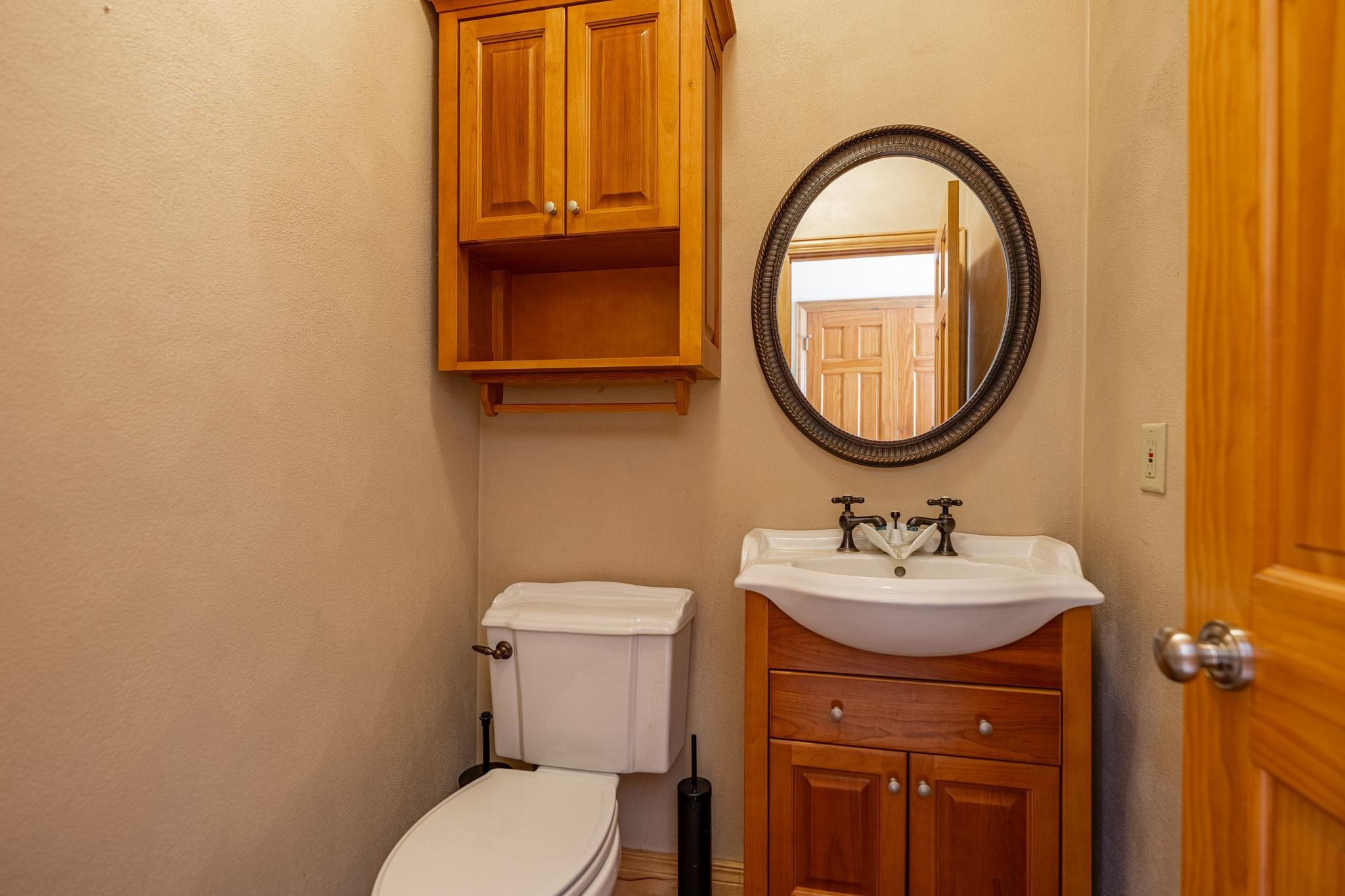 12830 Beloit Road Caledonia, IL 61011 - Photo 21 of 52 a bathroom with a sink mirror and toilet