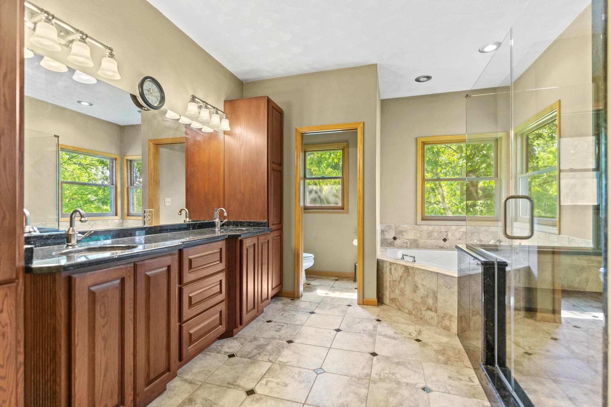 12830 Beloit Road Caledonia, IL 61011 - Photo 25 of 52 a large bathroom with a large tub and sink