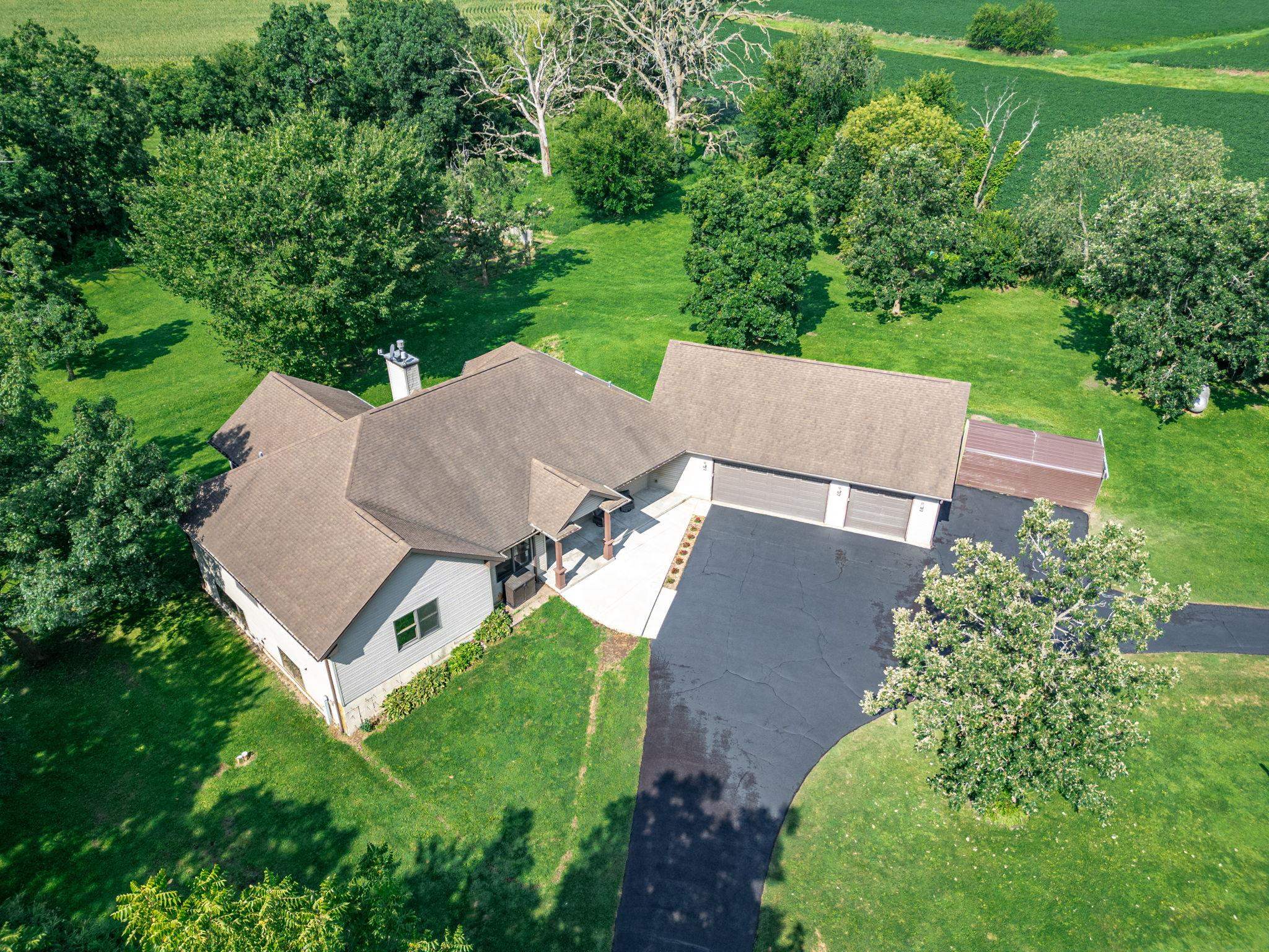 12830 Beloit Road Caledonia, IL 61011 - Photo 3 of 52 an aerial view of a house with a garden