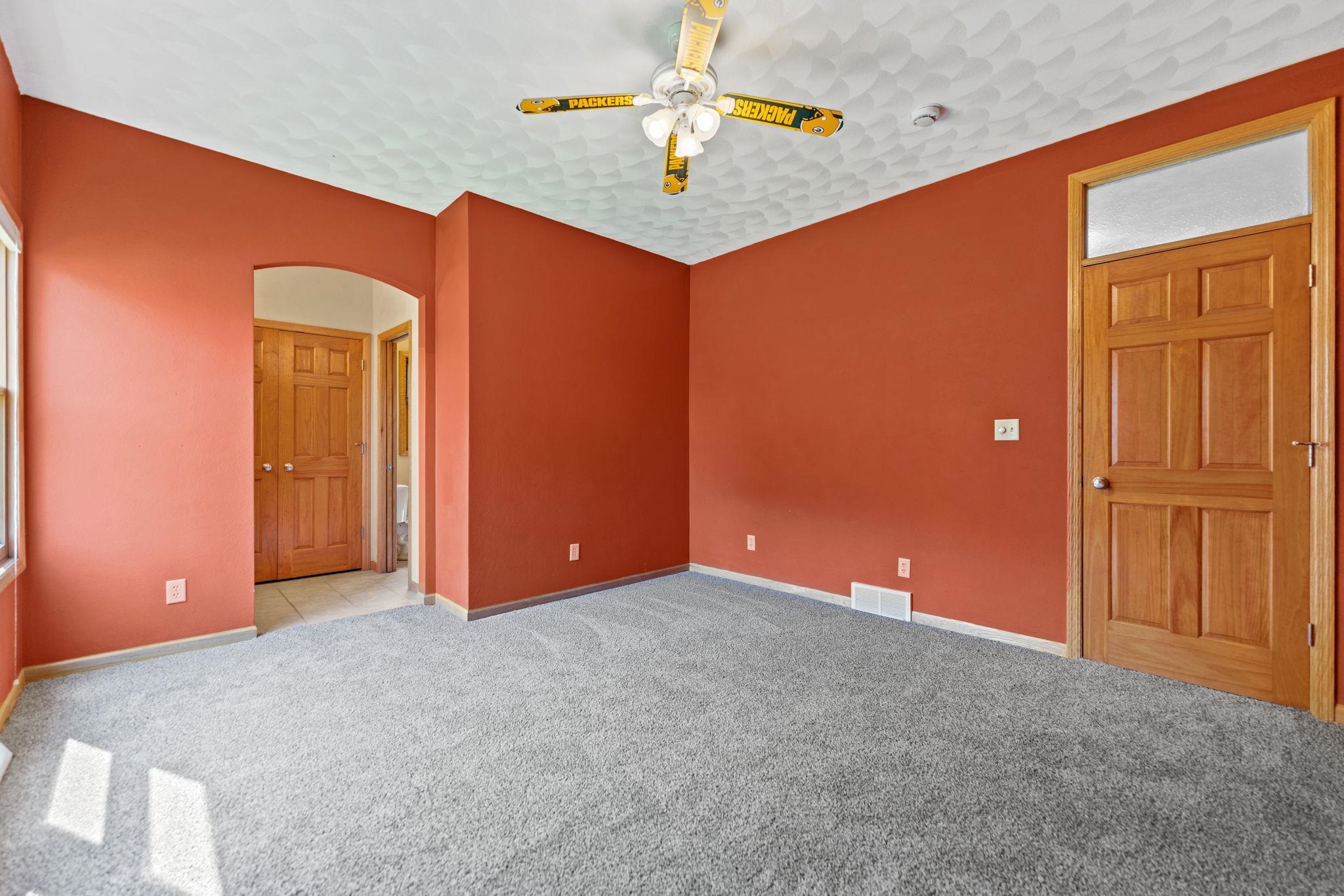 12830 Beloit Road Caledonia, IL 61011 - Photo 36 of 52 an empty room with closet and a chandelier fan