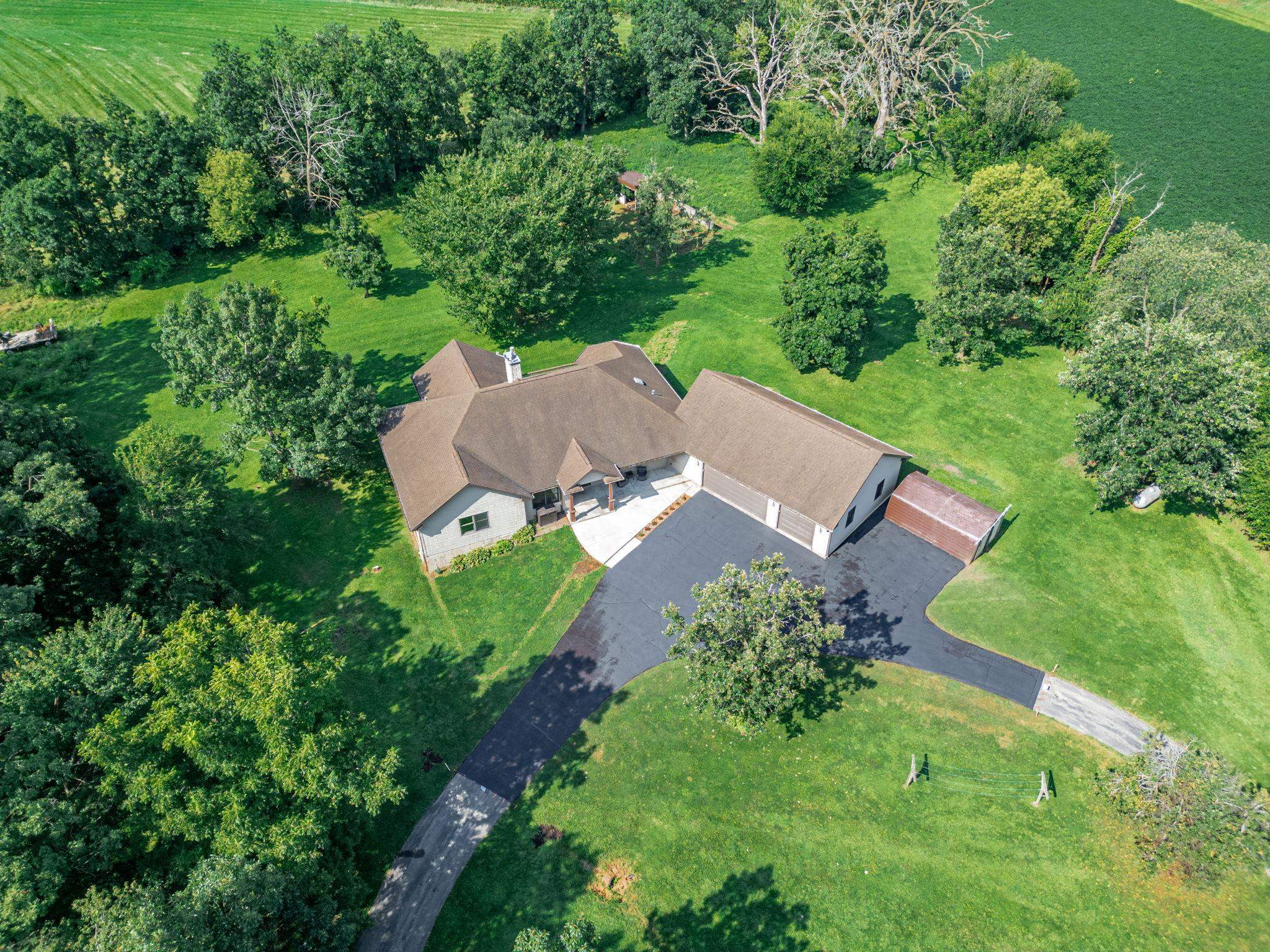 12830 Beloit Road Caledonia, IL 61011 - Photo 4 of 52 an aerial view of a house with yard