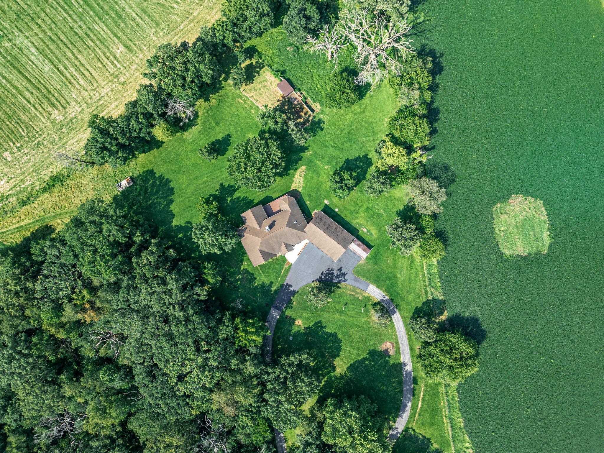 12830 Beloit Road Caledonia, IL 61011 - Photo 49 of 52 an aerial view of a house with a yard