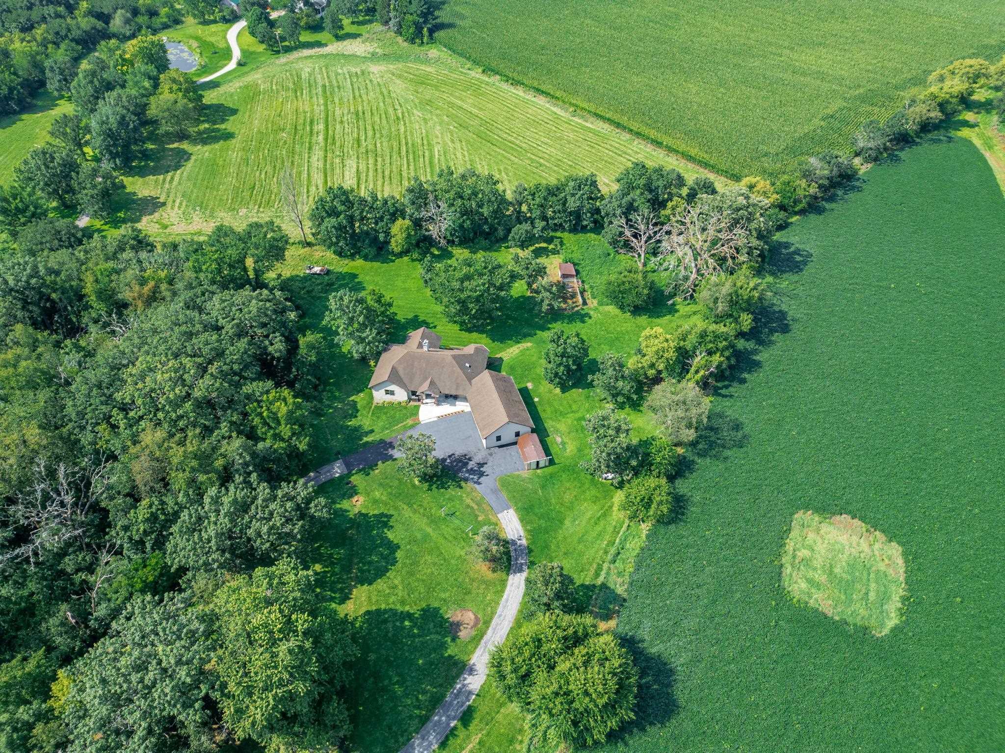 12830 Beloit Road Caledonia, IL 61011 - Photo 50 of 52 an aerial view of a house with a yard