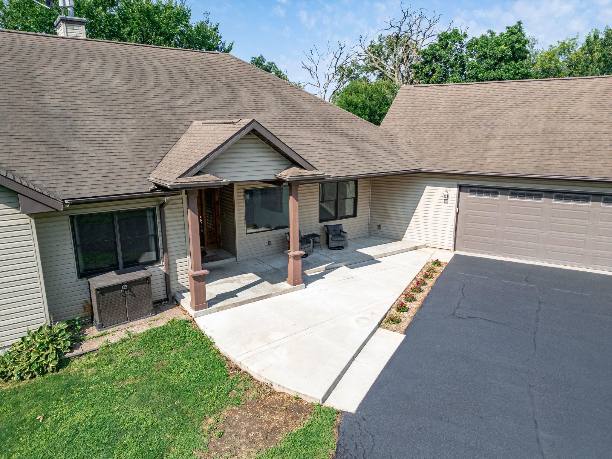 12830 Beloit Road Caledonia, IL 61011 - Photo 6 of 52 a view of a house with backyard and porch