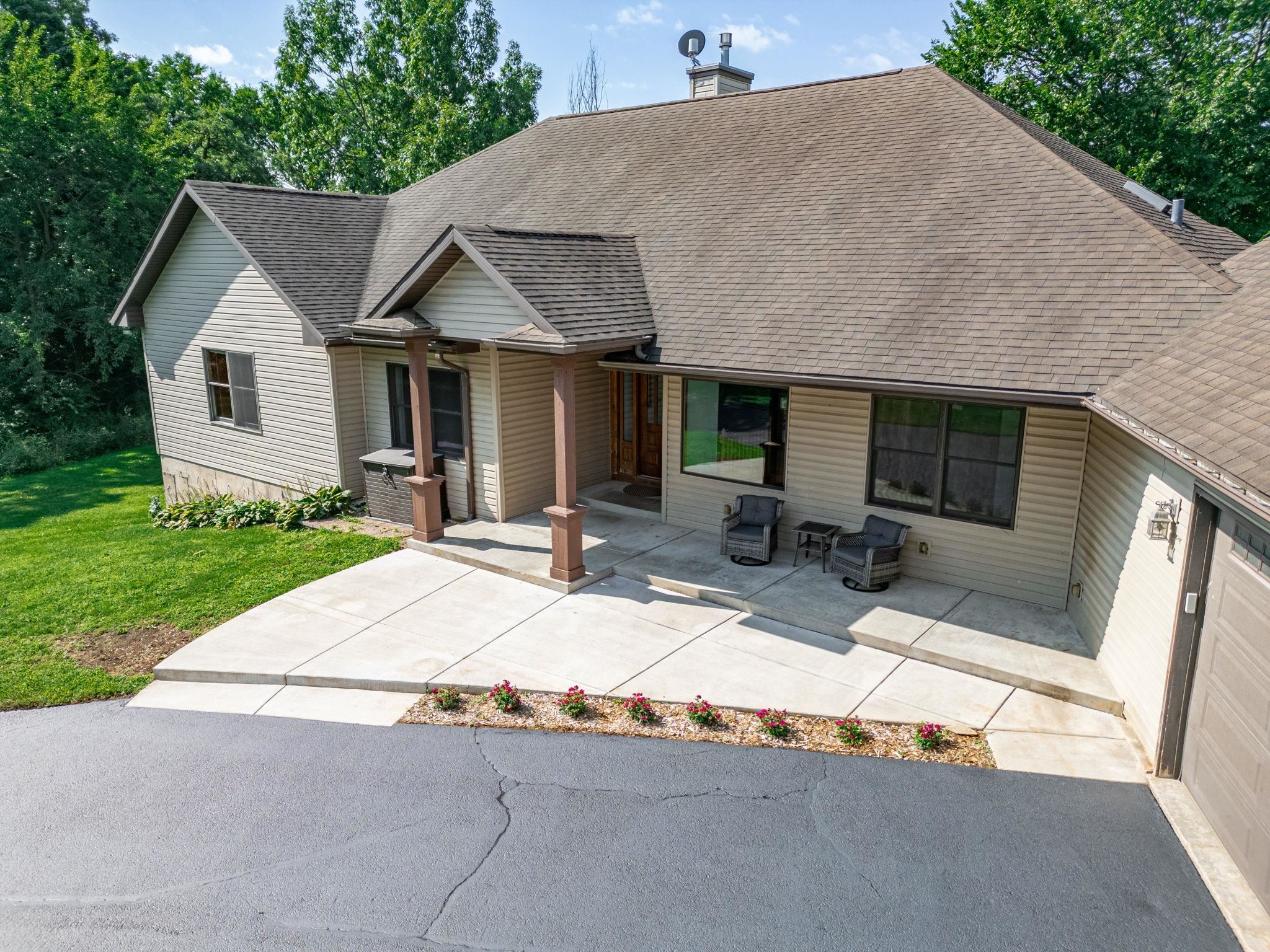 12830 Beloit Road Caledonia, IL 61011 - Photo 7 of 52 a house view with a outdoor space