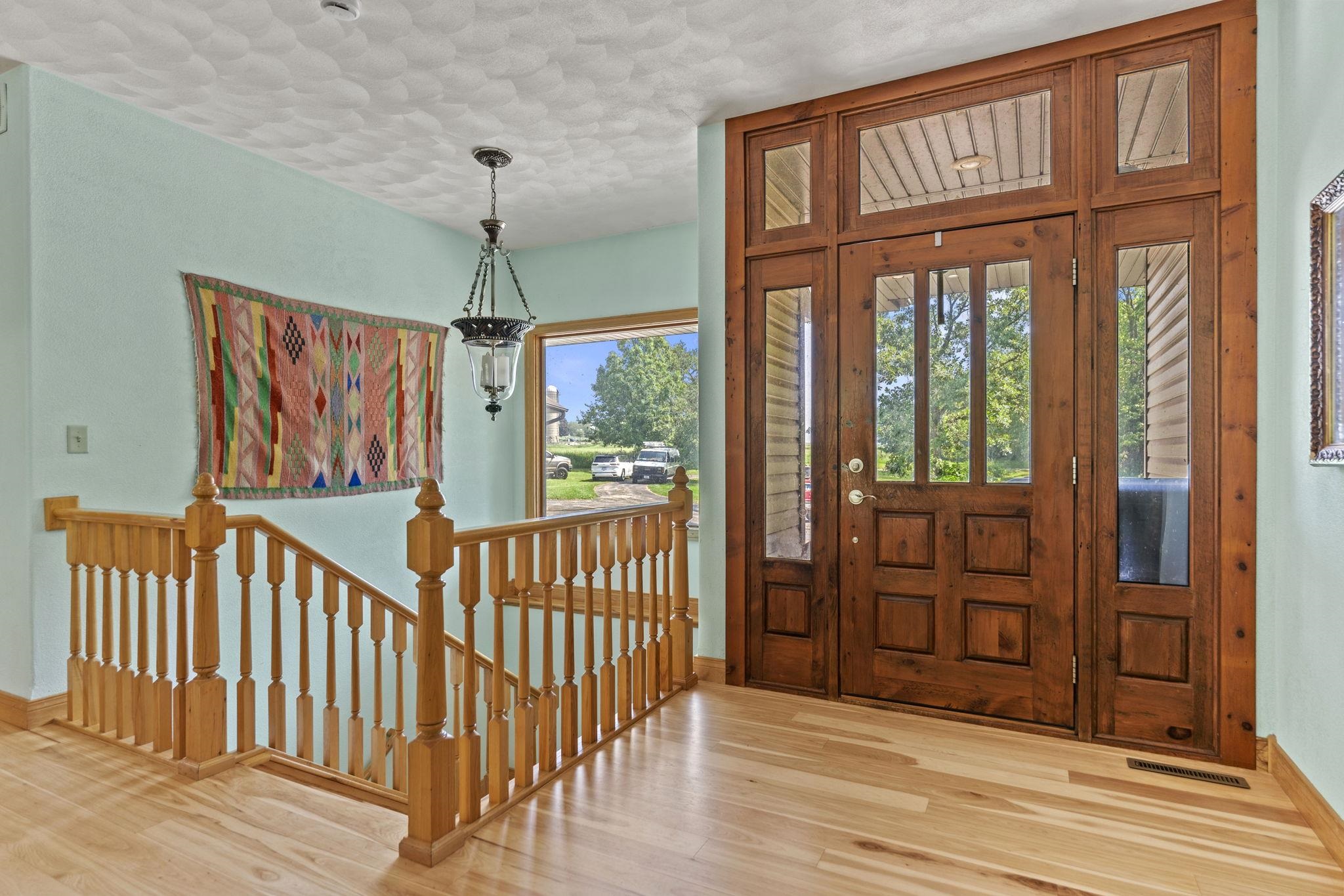 12830 Beloit Road Caledonia, IL 61011 - Photo 9 of 52 a view of a balcony with wooden floor