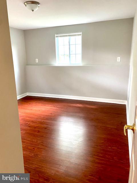 19002 Quail Valley Boulevard Gaithersburg, MD 20879 - Photo 19 of 35 an empty room with wooden floor and windows