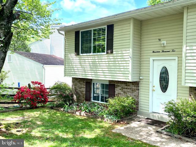 19002 Quail Valley Boulevard Gaithersburg, MD 20879 - Photo 2 of 35 a view of a house with a yard and potted plants
