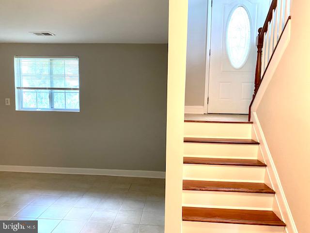 19002 Quail Valley Boulevard Gaithersburg, MD 20879 - Photo 26 of 35 a view of staircase with a large window