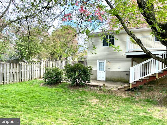 19002 Quail Valley Boulevard Gaithersburg, MD 20879 - Photo 34 of 35 a view of a house with a yard and deck