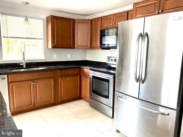 19002 Quail Valley Boulevard Gaithersburg, MD 20879 - Photo 5 of 35 a kitchen with stainless steel appliances granite countertop a refrigerator a stove a sink and a microwave