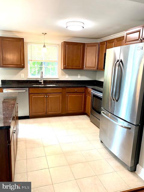 19002 Quail Valley Boulevard Gaithersburg, MD 20879 - Photo 6 of 35 a kitchen with stainless steel appliances granite countertop a refrigerator and a stove top oven