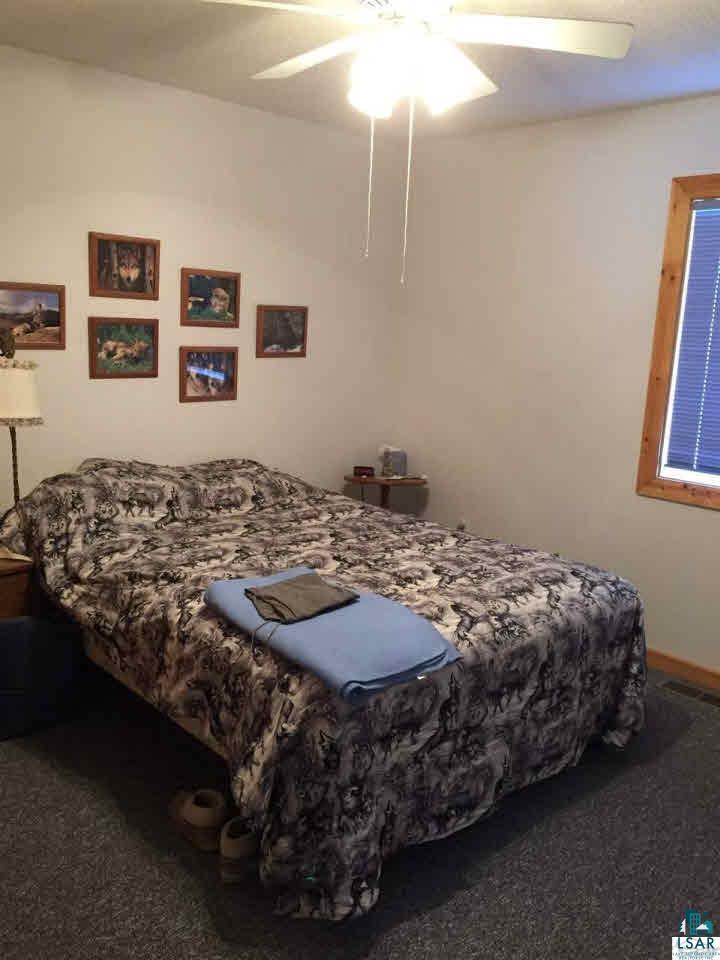 8141 Middle Road Minong, WI 54859 - Photo 11 of 25 Main Floor Master Bedroom. Bathroom is right around the corner.