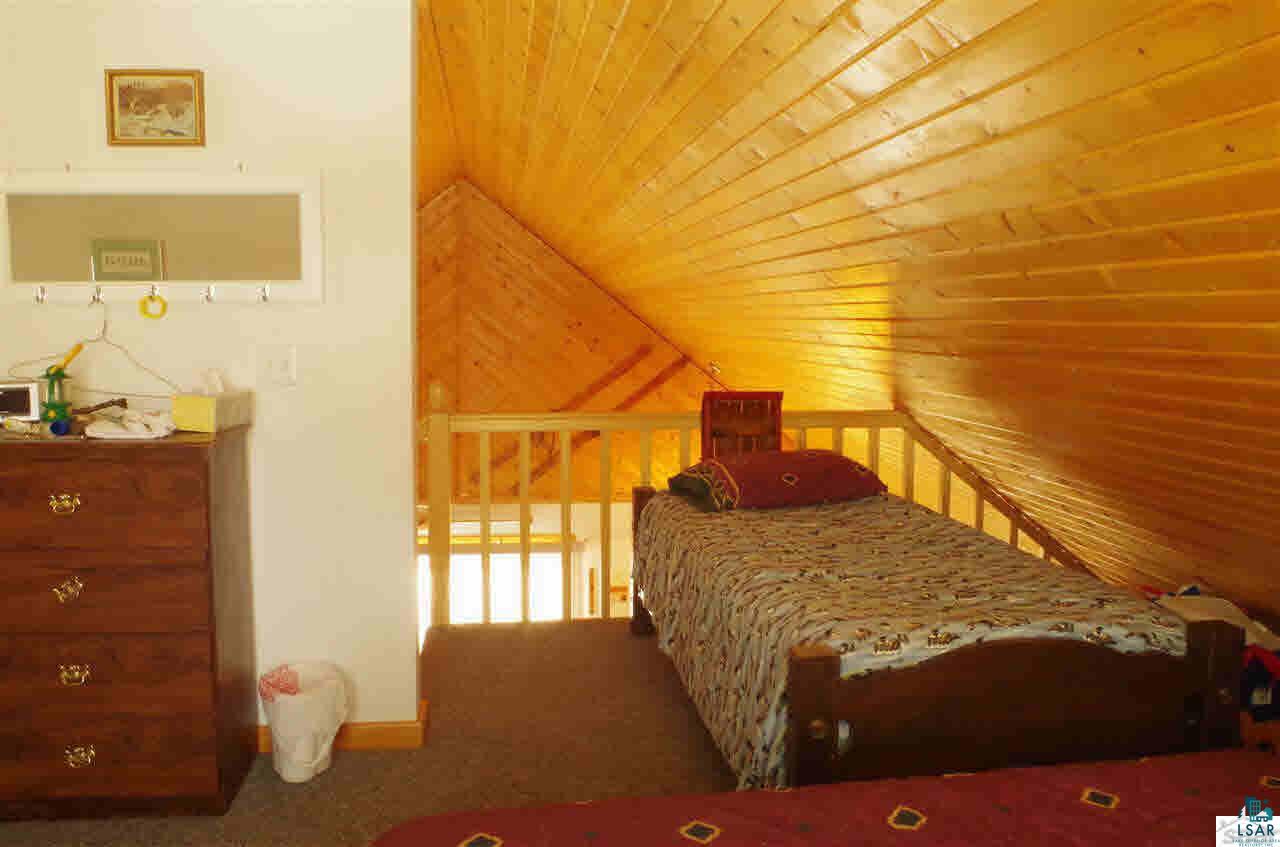 8141 Middle Road Minong, WI 54859 - Photo 13 of 25 Large loft. Big enough for 3 full size beds with room to spare.