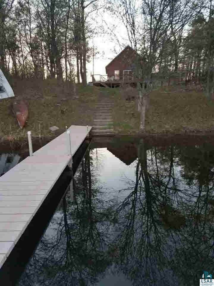 8141 Middle Road Minong, WI 54859 - Photo 16 of 25 From Pier to House. Gentle hill makes for a beautiful view of the lake from both Lower level & Deck