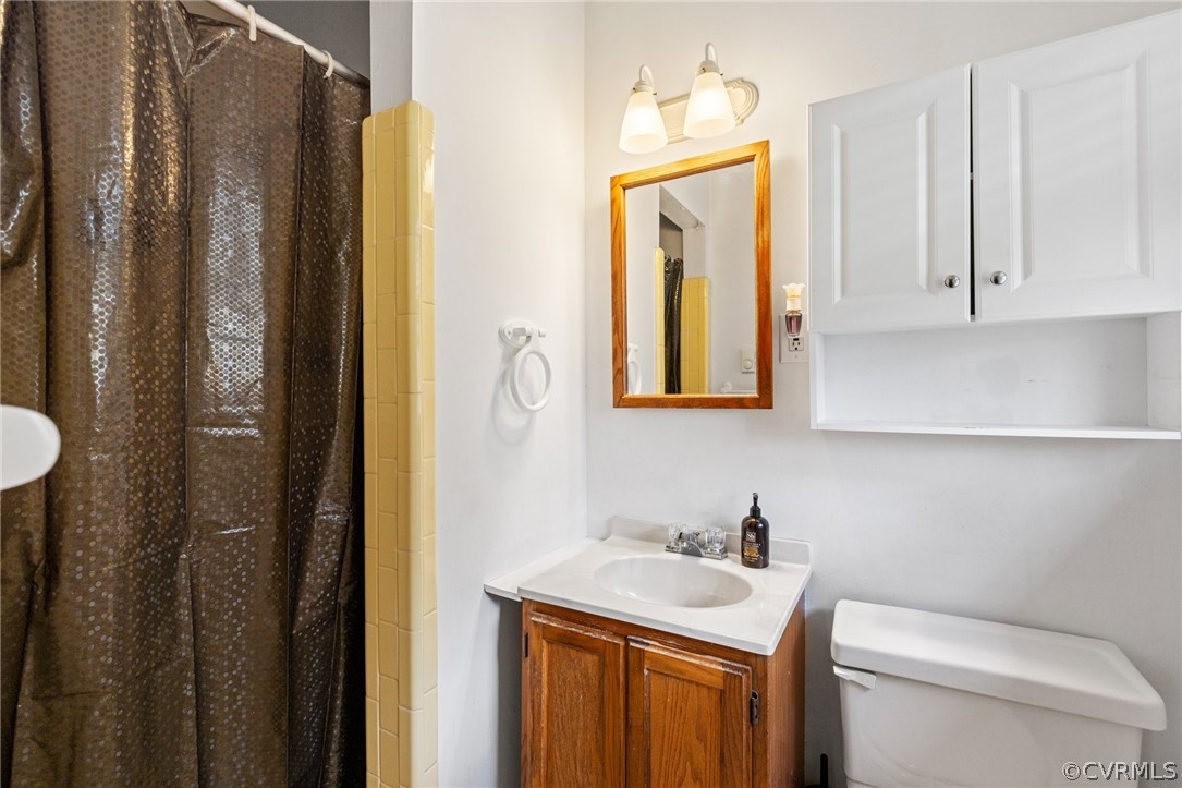 4840 Vestry Road North Chesterfield, VA 23237 - Photo 19 of 38 a bathroom with a toilet sink and mirror
