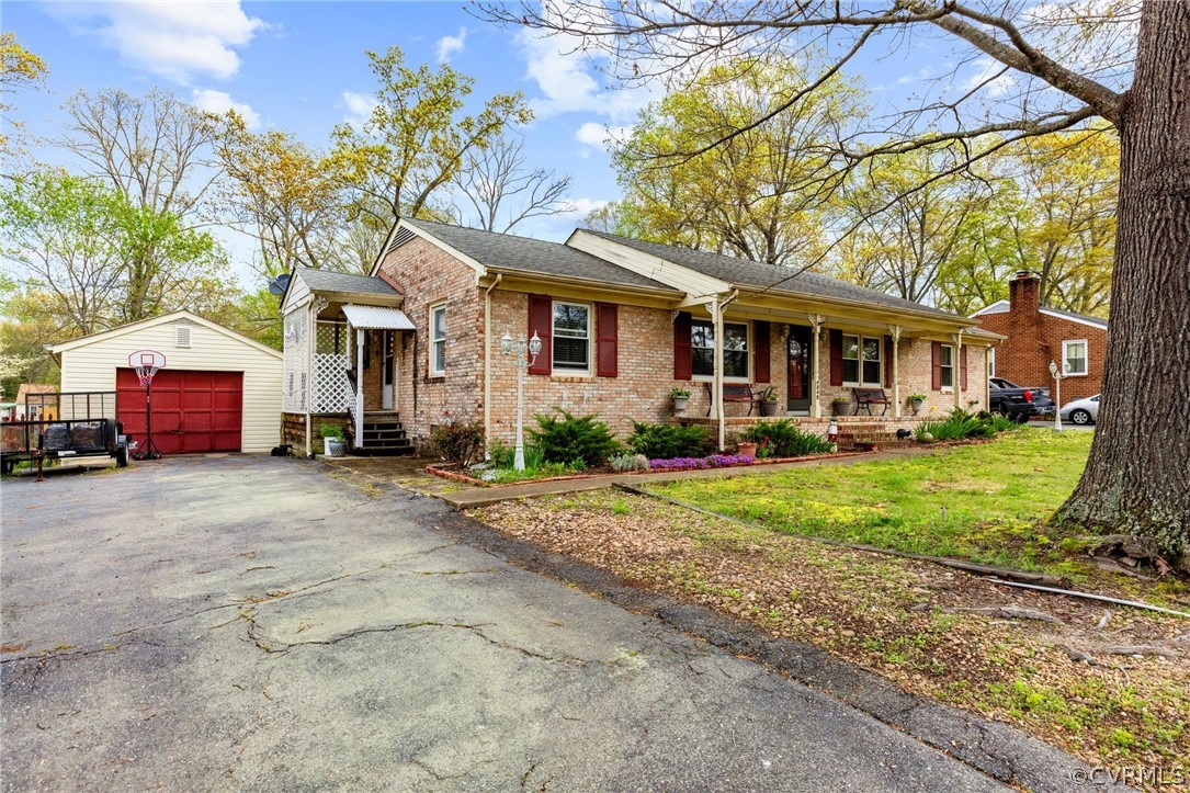 4840 Vestry Road North Chesterfield, VA 23237 - Photo 2 of 38 a front view of a house with a yard and a garage