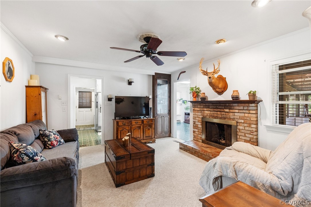 4840 Vestry Road North Chesterfield, VA 23237 - Photo 32 of 38 a living room with furniture a flat screen tv and a fireplace