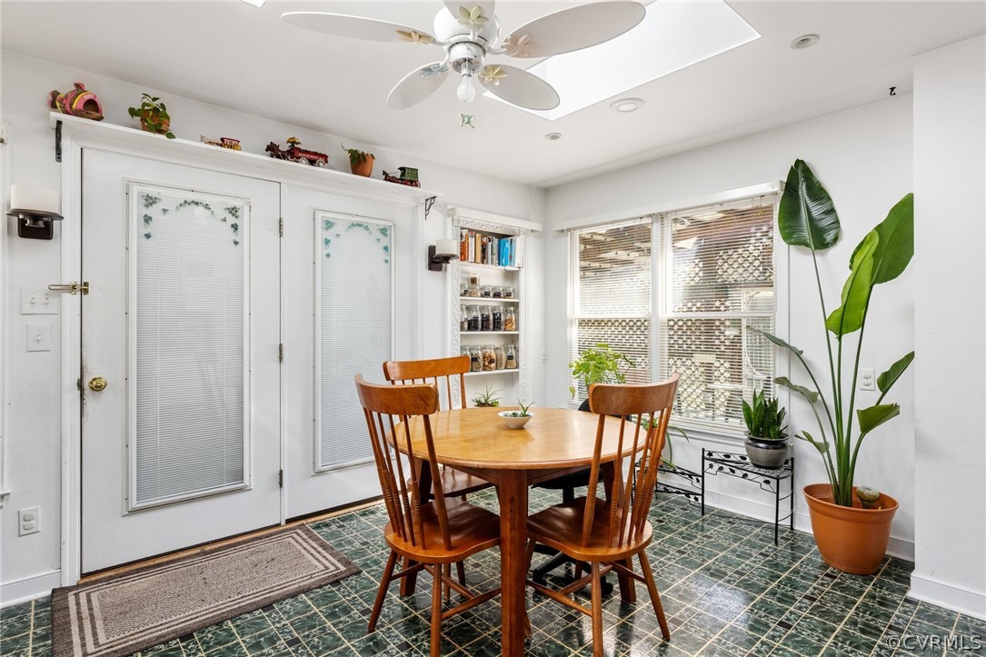 4840 Vestry Road North Chesterfield, VA 23237 - Photo 7 of 38 a dining room with furniture potted plants and wooden floor