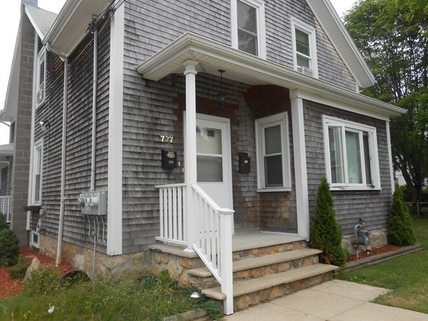 777 New Boston Road Fall River, MA 02720 - Photo 13 of 13 a view of brick house with large windows and a small yard